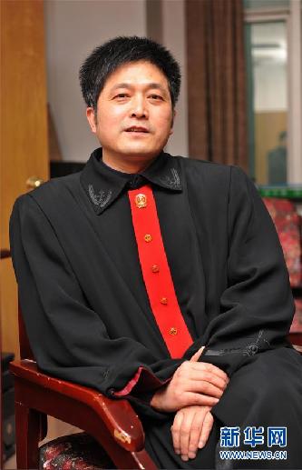 （圖文互動）其人如蘭，既潔且馨——追記“全國模范法官”胡國運