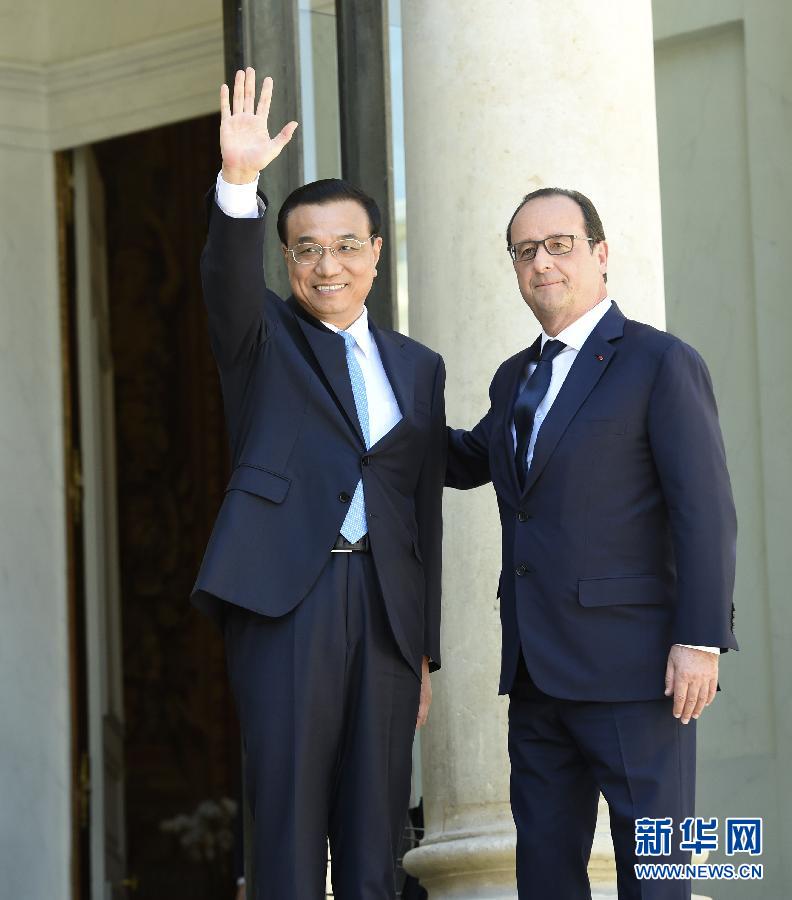 當?shù)貢r間6月30日下午，中國國務(wù)院總理李克強在巴黎愛麗舍宮會見法國總統(tǒng)奧朗德。 新華社記者李學仁攝 